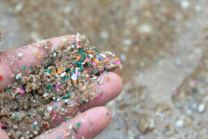 Microplastic particles in the palm of a hand